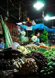 Street vendor beneath solar powered light