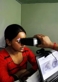 Girl getting a biometric eyescan